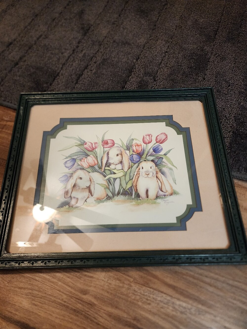 Green framed bunny picture.